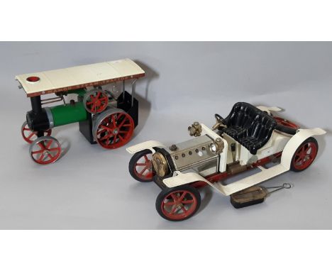 2 Mamod steam models comprising a white Roadster car with black seat and red spoked wheels, length 40cm and a Steam Tractor, 