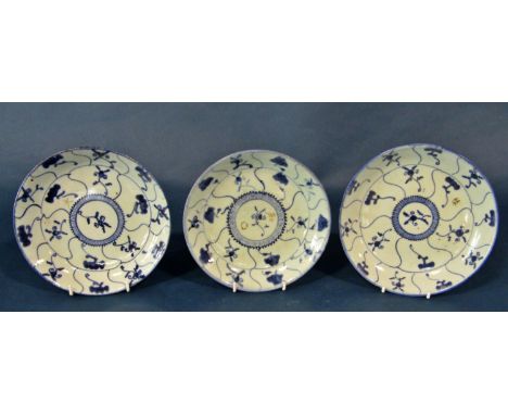 Three late 18th century Chinese export blue and white porcelain plates, each decorated with concentric medallions and incised