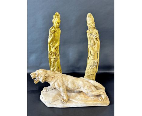 A tall pair of Chinese carved simulated ivory tusks, one in the form of Guanyin, the other of a sage and attendant, each with