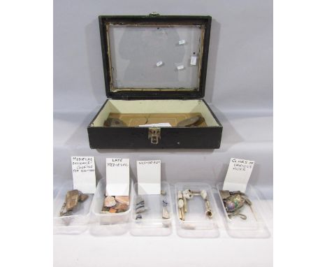 Five prehistoric item,  two flint axe heads and three arrow heads in display cabinet together with five tubs of antiquities i