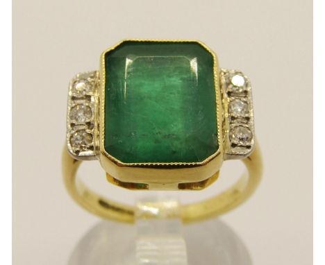 18ct emerald and diamond dress ring, the emerald 12.5 x 9.5mm approx, maker 'DOM', Birmingham 1994, size L, 5.6g (see photogr