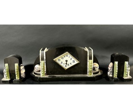 An Art Deco polished slate and marble mantle clock garniture, the clock measuring 23  cm high, 44cm wide. 
