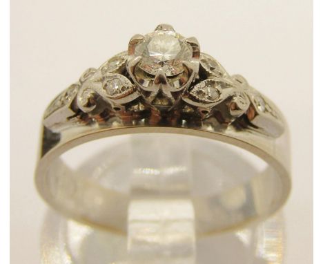 Art Deco style 18ct white gold diamond ring with raised setting, centre claw-set stone 0.15ct approx, size K/L, 4g (see photo