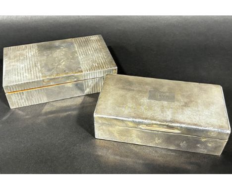 A silver cigarette box monogrammed  E W to the engine turned lid, London 1935, maker Thomas William Lack, together with anoth