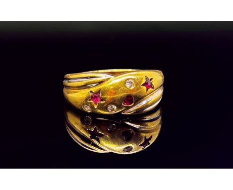 An 18ct two-tone gold, diamond and ruby set ring, with love heart and star motifs, marked 18k, size L, 5.4g (sold in a small 