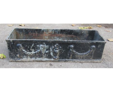 A vintage weathered rectangular cast iron planter with classical raised relief swag and urn detail, 15cm h x 60cm l x 21cm d