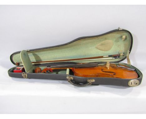 An old violin in the Stradivarius style bearing no makers labels, 59 cm overall, back 35.5cm with an un-marked bow, with a ca