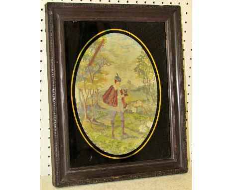 19th century needlework of a man wearing a red cloak in a rural scene, 23 x 18 cm, oval mounted in wooden frame 