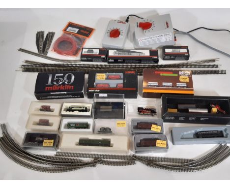 Collection of Z gauge railway models comprising locomotives, coaches, rolling stock, track, transformer and controller. Inclu