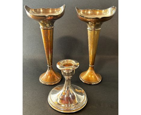 A pair of early 20th century silver posy vases with a flared floral rim, Birmingham 1919, maker Henry Williamson on weighted 