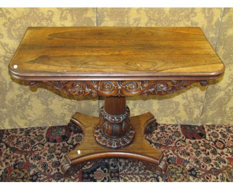 19th century rosewood D end foldover card table raised on a central column with platform base, with scrolled toes and further