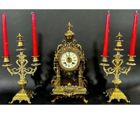A continental gilt brass mantle clock garniture, the clock 39cm high. 