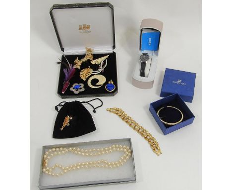 Costume jewellery to include a Lorus watch, a Swarovski brooch and bangle, a Monet curb link bracelet and faux pearl necklace