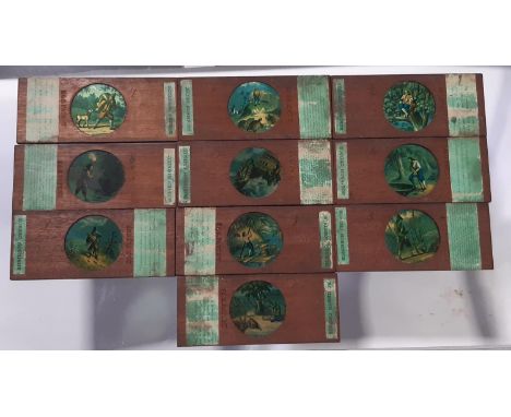 10 Victorian coloured magic lantern slides, Robinson Crusoe, circular in mahogany casework with printed script, B &amp; S pat