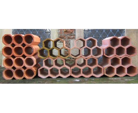 Six small honeycomb shape clay pipe sections, together with four others (capable of stacking and use as planters/wine racks, 