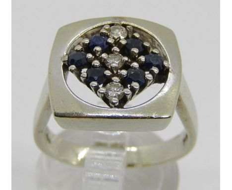 An unusual 18ct white gold, sapphire and diamond set dress ring, with openwork mount, size N/O, 10g