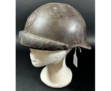 A French WWI period Trench Helmet, with applied ‘R F’ insignia. 