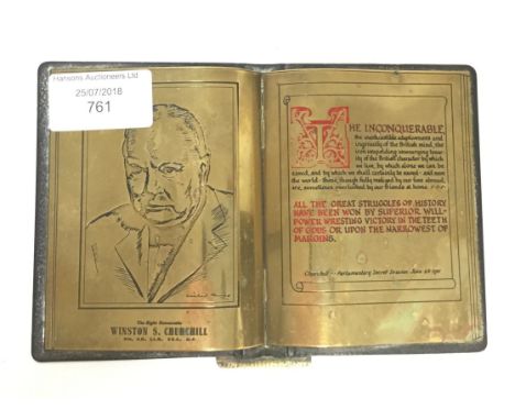 WW2 British Winston Churchill commemorative brass desk ornament in the form of an upright open book standing upon a circular 