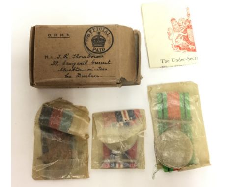 WW2 British 1939 - 45 Star, Defence Medal and War Medal 1939-1945 in original box with ribbons and award slip, Awarded to JR 