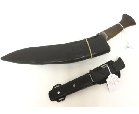 WW2 era Gurhka Kukri Knife. 30cm long blade. Wooden grip. No small knives. Complete with scabbard. No date or makers marks. A