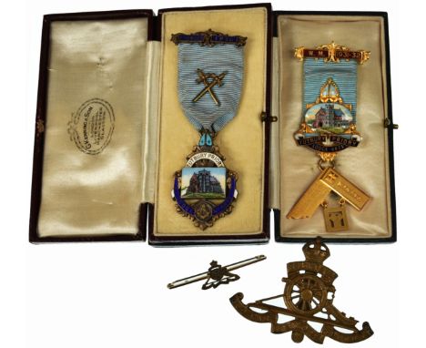 Pair of cased Masonic medals for Tutbury Priory Lodge, gilt with enamel panels showing the Priory. Both made by G Kenning & S