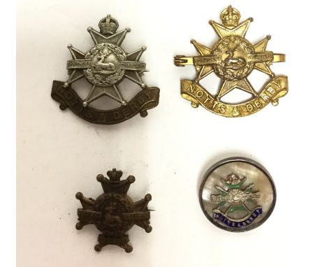 A collection of four Notts and Derby Regiment (Sherwood Foresters) sweetheart badges, all cap badges designs. First is in gil