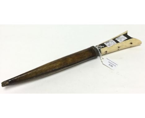 An Asian Dagger with 170mm long blade. Bone handle Complete with wooden scabbard.