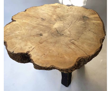 TREE TRUNK TABLE, ash tree trunk section raised upon four rustic tapered supports, 83cm x 72cm x 65cm H.