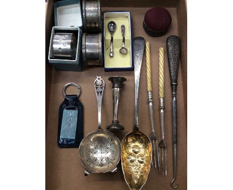 Three silver napkin rings, silver tea strainer, silver berry spoon, other silver items and pair plated forks