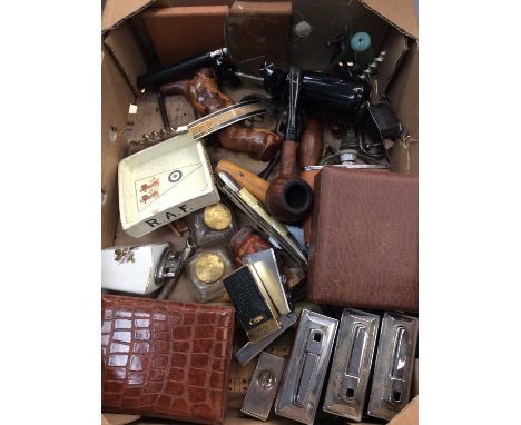 Box smoking items including lighters, two large cigars, pipe, corkscrews and sundries