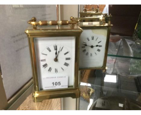 Two brass cased carriage clocks with white enamel dials and Roman numerals, both with keys