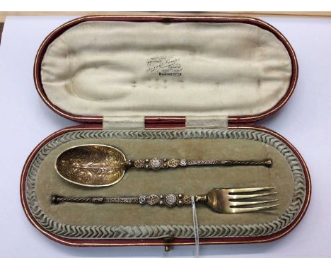 Silver gilt spoon and fork set in fitted case