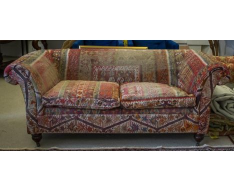 CHESTERFIELD SOFA, 76cm H x 195cm x 96cm Victorian style in kilim and velvet upholstery on brass castors. 