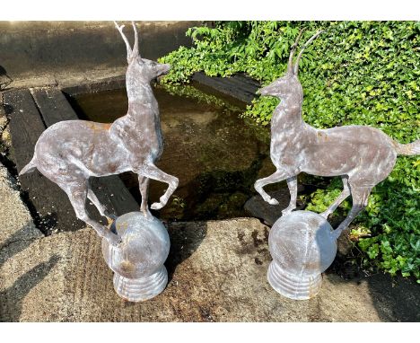 ARCHITECTURAL STAG FINIALS, a pair, 93cm H. (2) 