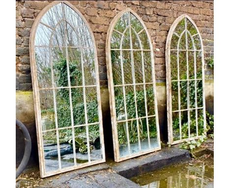 ARCHITECTURAL GARDEN MIRRORS, three, 157.5cm x 66cm, aged metal frames. (3) 