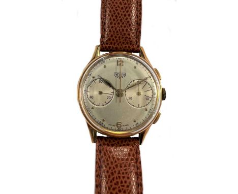 Heuer - An 18ct gold 'Big Eye' chronograph wristwatch, circa 1955, model number 418, the signed circular silvered dial, 32mm 