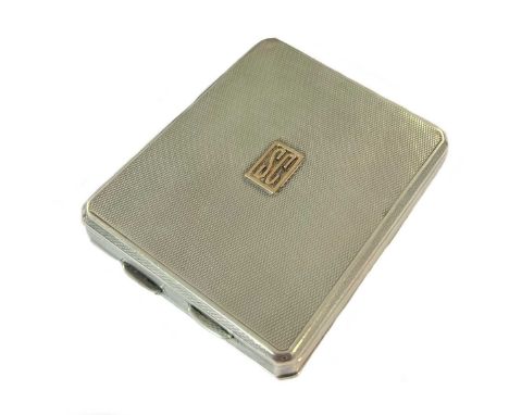 An Edward VIII silver double sided combination cigarette case and compact, mark of Cohen &amp; Charles, London 1936, of recta