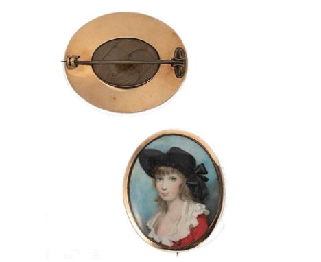 Y A late 18th century portrait miniature memorial brooch, oval shaped, with a portrait on ivory of a smartly dressed young gi