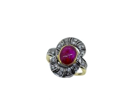 A ruby and diamond dress ring, rubover set oval cabochon ruby, approximately 8.5 x 6.9mm, estimated approximate weight 1.90ct