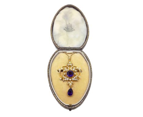An amethyst and split pearl pendant/brooch and chain, openwork scroll design, with a central round faceted amethyst and a pea