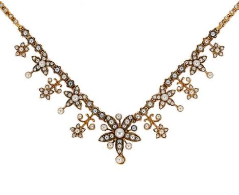An Edwardian split pearl necklace, graduated floral front section, central flower with a vacant hook fitting, detachable spli