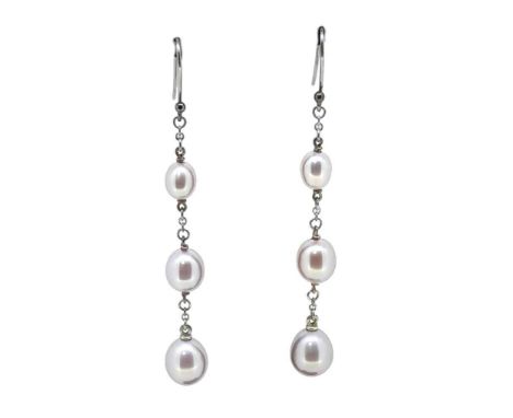 Elsa Peretti for Tiffany &amp; Co. - A pair of pearl ear pendants,  each with three graduating oval shaped light pink pearls,