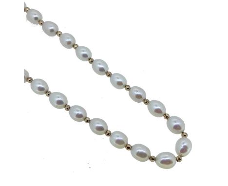A pearl necklace, thirty eight freshwater pearls, each separated by a gold roundel, length 46cm, unhallmarked, stamped '375',
