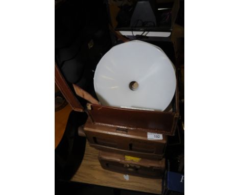Small leather suitcase, two opaque glass lamp shades, two card Shirt and Collar Service boxes