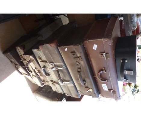 Collection of seven vintage suitcases and a vanity case