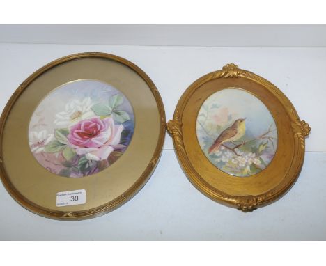 Gilt framed painted ceramic plaque depicting roses signed and gilt framed ceramic plaque depicting a bird in tree setting bot