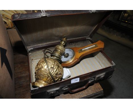 Small leather suitcase, relief moulded gilt table lamp and modern barometer