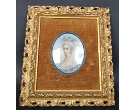 A 19th Century hand painted portrait of an aristocrat lady. In a pierced gilt frame with brown material ground and an oval po