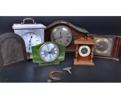 A collection of vintage retro mid 20th century mantel clocks to include a Louis Bernard style clock along with Bentima faux o