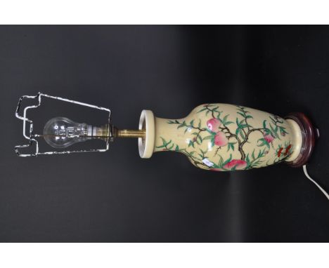 A vintage 20th Century Famille rose oriental Chinese vase converted lamp. With light fixture to top, light shade holder, with